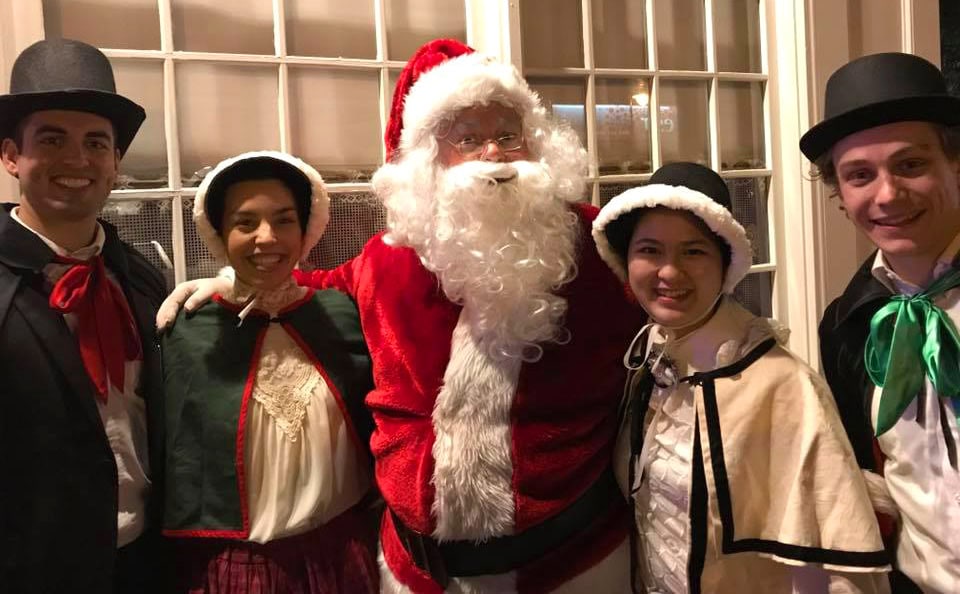The carolers stop for a pic with Santa during Dorchester, MA's annual tree lighting.