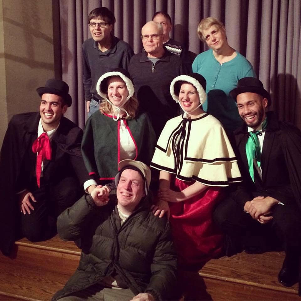 The Boston carolers pose with some fans during a gig in 2015.