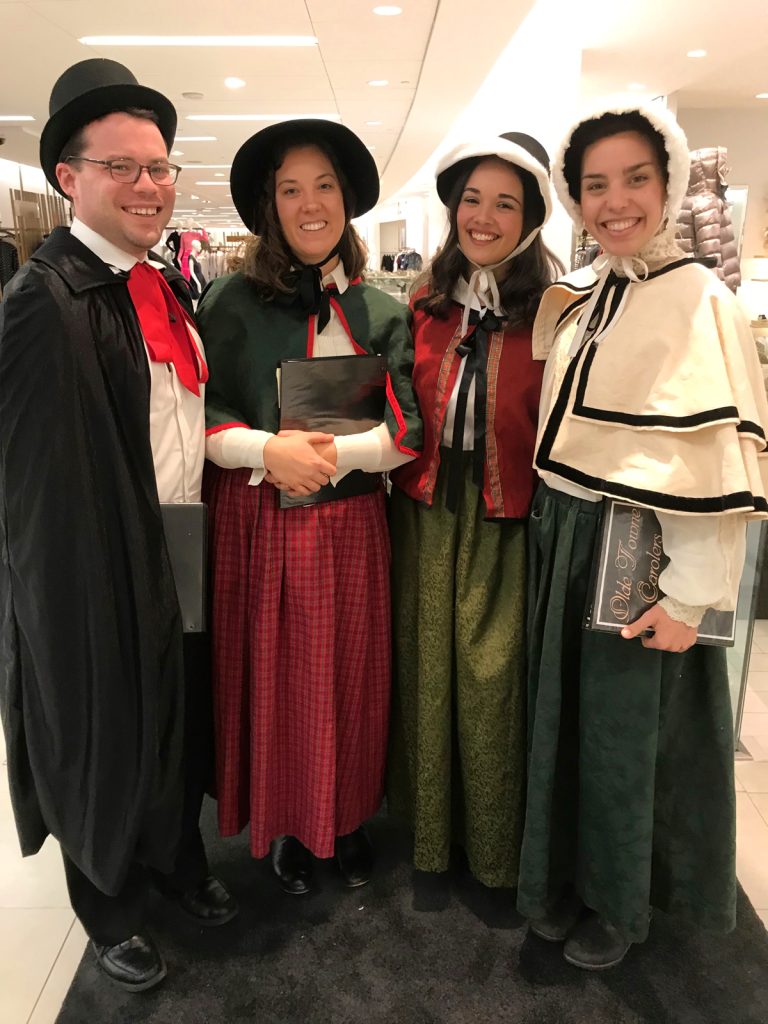 The carolers perform for shoppers at Saks 5th Avenue in Boston, MA.
