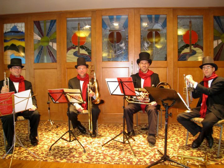 The Brass Quartet prepares to perform at Kirkland Village.