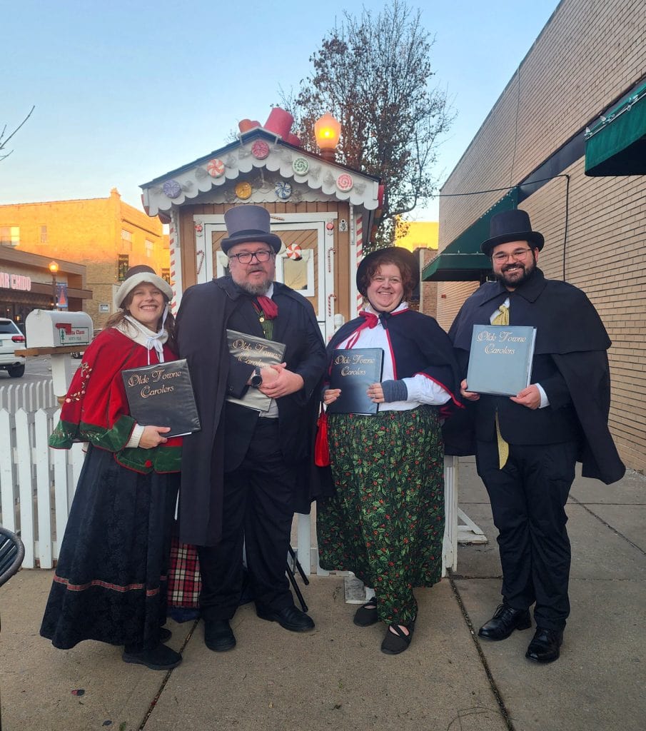 The carolers perform on Curtis Street in downtown Downer's Grove, IL.