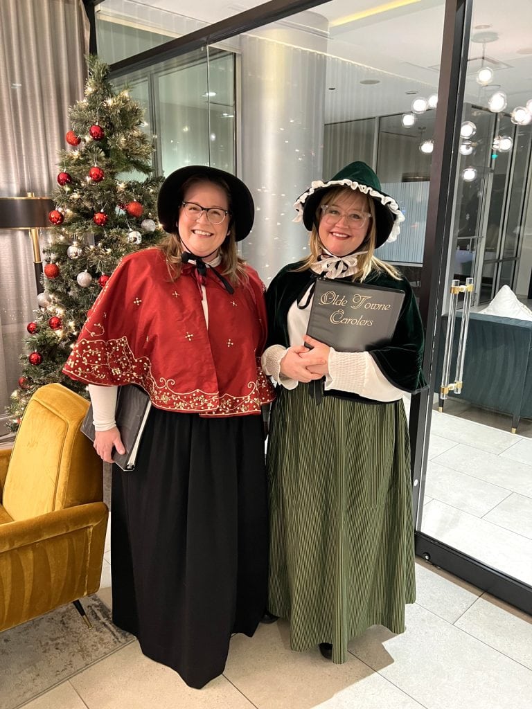 Leah and Vera prepare to deliver a special Singing Carol-Gram to an office.