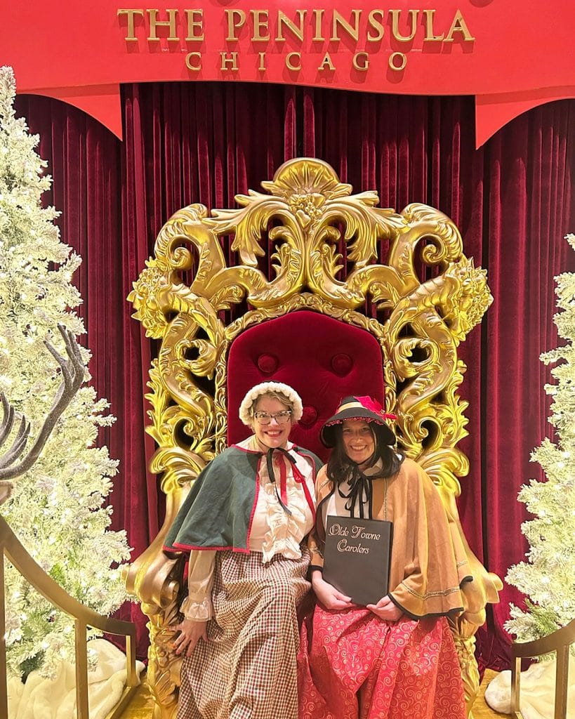 Brenna and Rena take a pretty moment while caroling for a holiday party at Chicago's Peninsula Hotel.