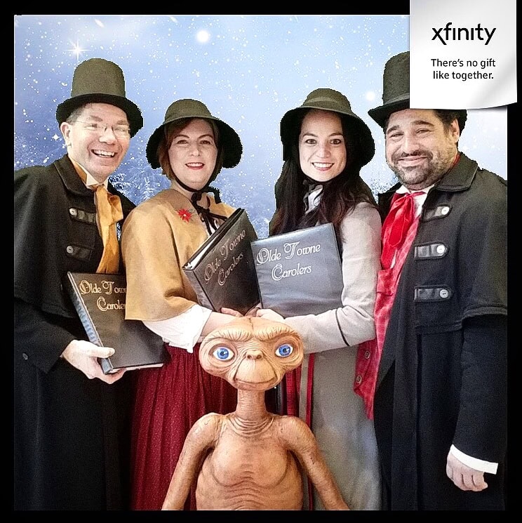 Our carolers make a new friend at a corporate Christmas party for Comcast Xfinity in Philadelphia.