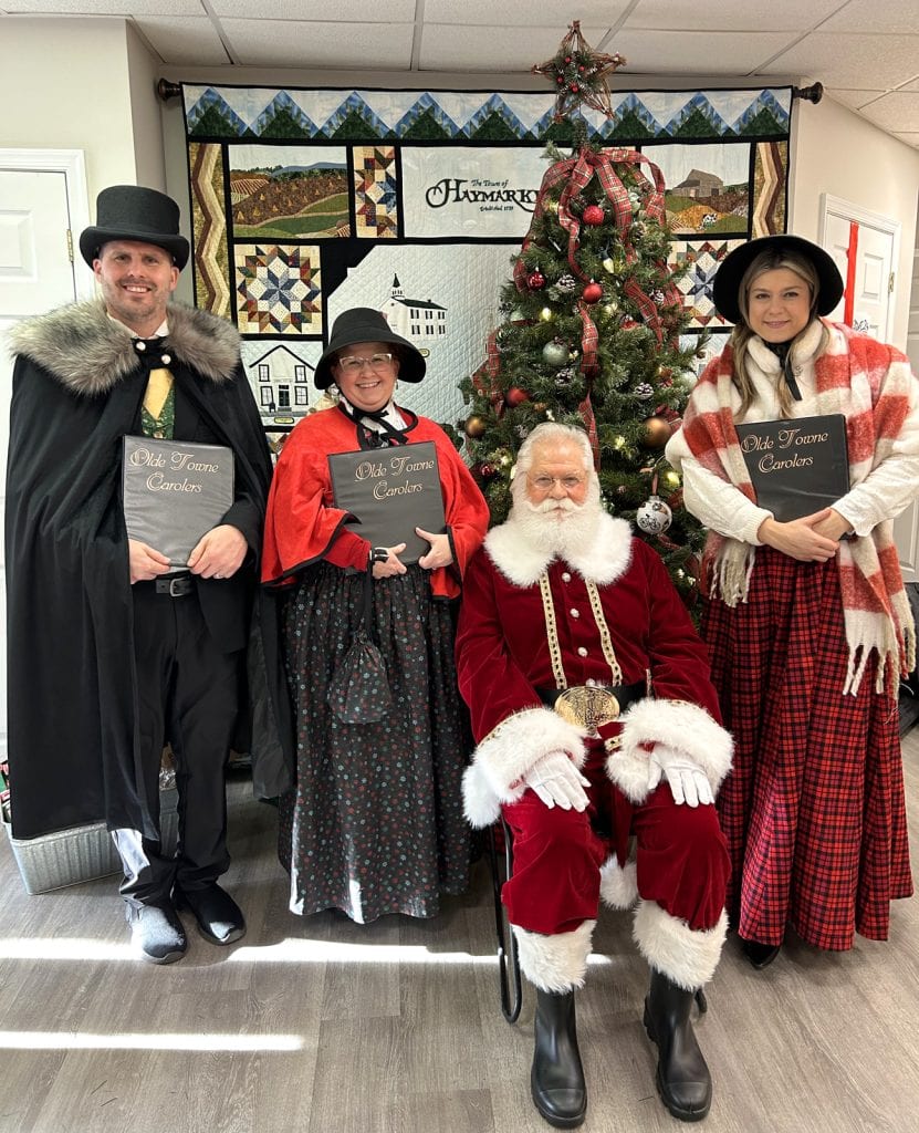 The carolers chat with Santa at the annual Haymarket, VA tree lighting festivities.
