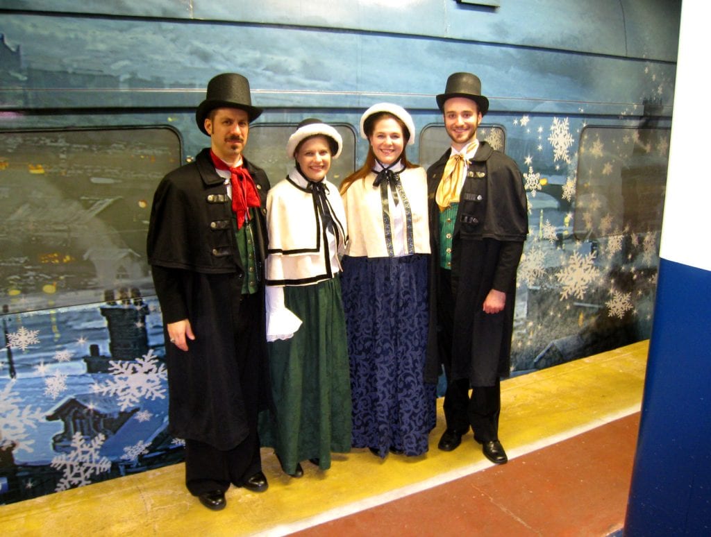 Brian, Darlene, Meghan, and Ryan carol for Disney's "A Christmas Carol" Train Tour.