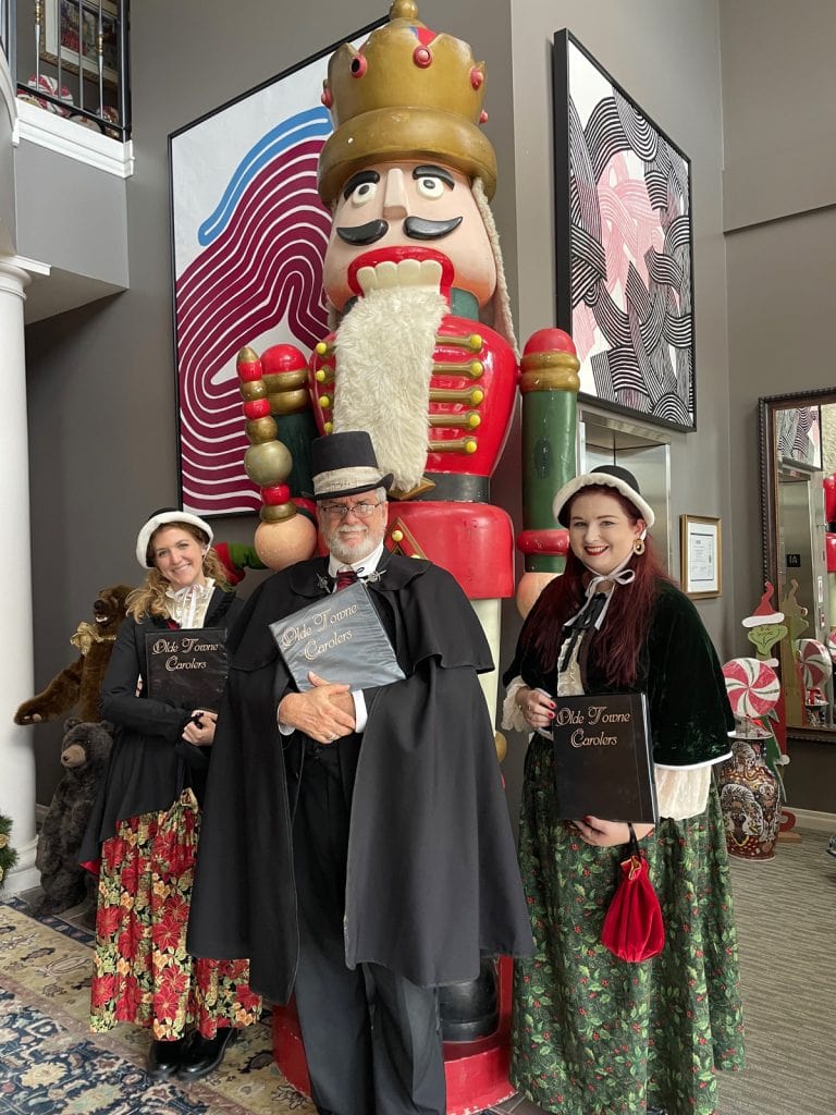 Olde Towne Carolers pose with a beautiful nutcracker during an appearance at Hoover Rehabilitation Services in Mechanicsburg, PA.