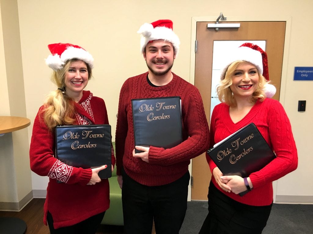 The carolers break out their casual look for a performance at Newtech Dental Laboratories in Lansdale, PA.