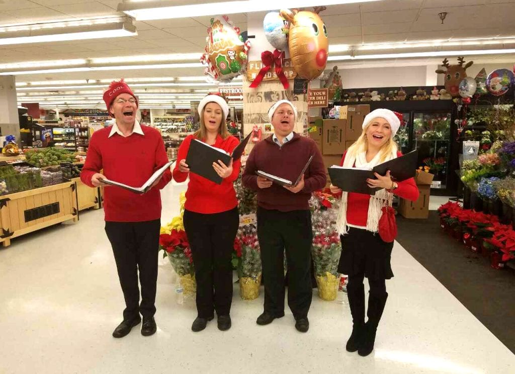 Not just Victorian carolers! Our singers are festively casual while entertaining at a ShopRite store.