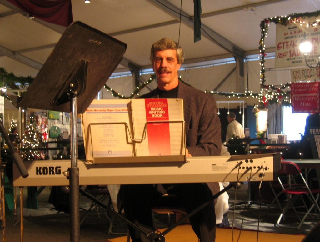 Terry Musselman plays the keyboard at Christkindlmarkt in 2005.